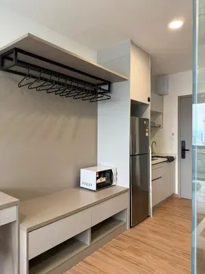 a kitchen with a counter with a microwave and a refrigerator at The Riv Riveria City KL Sentral Kuala Lumpur by Nestaway in Kuala Lumpur