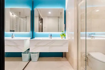 a bathroom with two sinks and a mirror at Romantic Home in KLCC in Kuala Lumpur