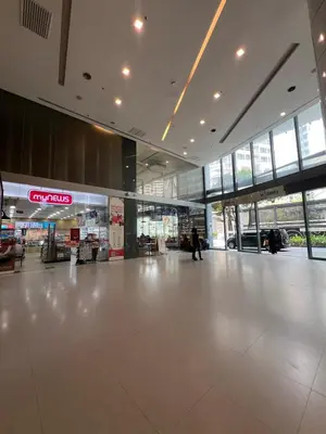 an empty lobby of a building with a large white floor at Mercu summer suites klcc luxury couple 1BR apartment with balcony, pool view free Netflix in Kuala Lumpur