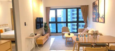 a living room with a couch and a table in a room at Service Apartment Agile Residence KL in Kuala Lumpur