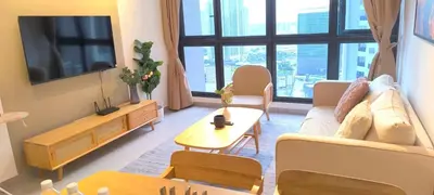 a living room with a couch and a table at Service Apartment Agile Residence KL in Kuala Lumpur