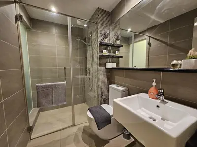 a bathroom with a sink and a shower and a toilet at Cozy Velocity Residence2 Linked to Mall 6pax Wifi 600mbps in Kuala Lumpur