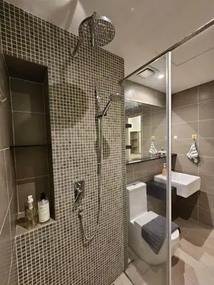 a bathroom with a shower and a toilet and a sink at Cozy Velocity Residence2 Linked to Mall 6pax Wifi 600mbps in Kuala Lumpur