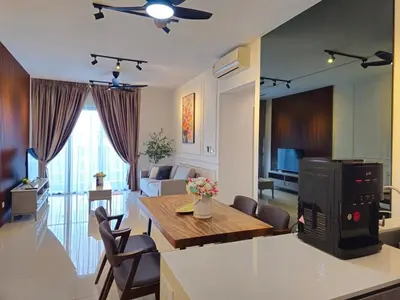 a kitchen and living room with a table and chairs at Cozy Velocity Residence2 Linked to Mall 6pax Wifi 600mbps in Kuala Lumpur