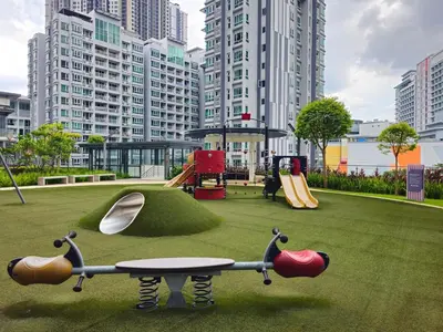 a park with a playground with a table and slides at Cozy Velocity Residence2 Linked to Mall 6pax Wifi 600mbps in Kuala Lumpur