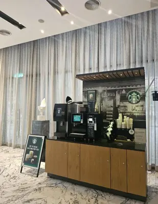 a coffee shop with a counter in a room at Star residence KLCC by J&K in Kuala Lumpur