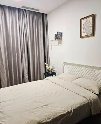 a bedroom with a bed and a window at Star residence KLCC by J&K in Kuala Lumpur