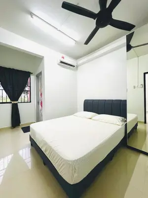 a bedroom with a bed with a ceiling fan at Homestay Ustaz Lumayan in Kuala Lumpur