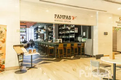 a restaurant with a bar and some chairs and tables at Suasana by TPL - Bukit Bintang KLCC in Kuala Lumpur
