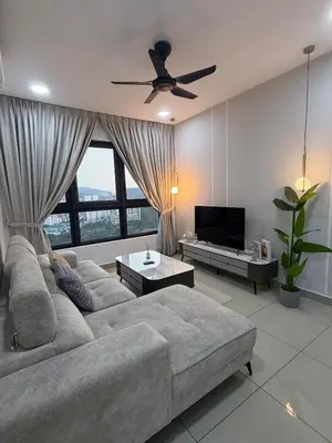 a living room with a couch and a flat screen tv at M Vertica w Infinity Pool Mrt TRX Sunway Velocity in Kuala Lumpur