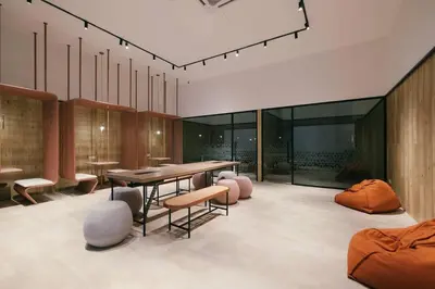 a dining room with a table and some chairs at M Vertica w Infinity Pool Mrt TRX Sunway Velocity in Kuala Lumpur