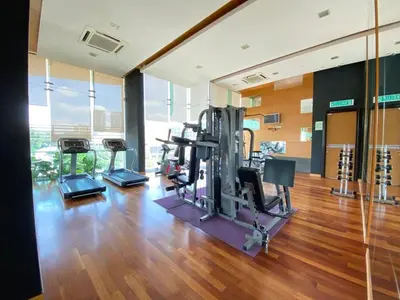 a gym with treadmills and ellipticals in a building at Casa Residency in Kuala Lumpur