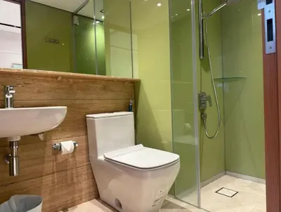 a bathroom with a toilet and a sink and a shower at Majestic Residence KLCC in Kuala Lumpur