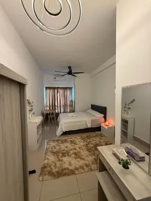 a bedroom with a bed and a ceiling fan at Razak City Residence KL City in Kuala Lumpur