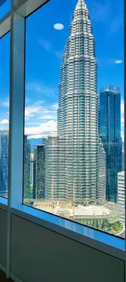 a view of a large building from a window at Sky Suites KLCC by TD Luxe Global in Kuala Lumpur