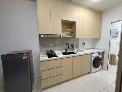 a kitchen with a sink and a dishwasher at Majestic Residences KLCC By Moonlight in Kuala Lumpur
