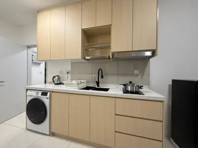 a kitchen with a sink and a washing machine at Majestic Residences KLCC By Moonlight in Kuala Lumpur