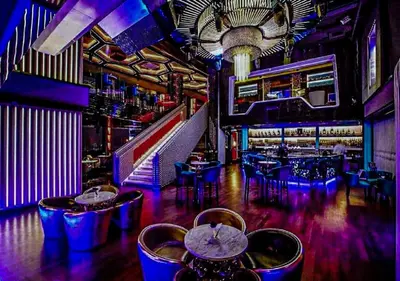 a bar with tables and chairs in a room at Platinum Suites Kuala Lumpur Malaysia By LuzBnB in Kuala Lumpur