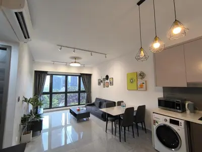 a kitchen and living room with a table and a couch at Sky View Agile Residence Bukit Bintang KL in Kuala Lumpur