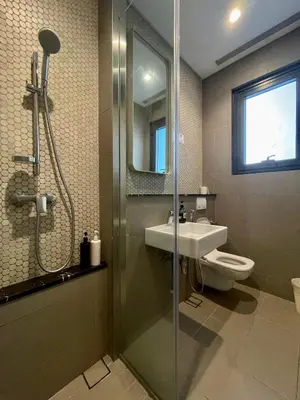 a bathroom with a shower and a sink and a toilet at Lucentia Residences By ONZO in Kuala Lumpur
