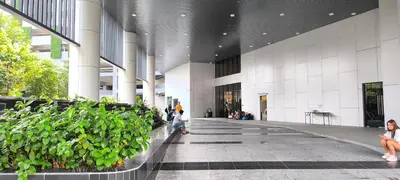 a hallway in a building with potted plants at Service Residence Agile Delima Residence KL in Kuala Lumpur