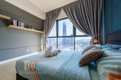 a bedroom with a bed with a large window at Continew Residences Kuala Lumpur in Kuala Lumpur
