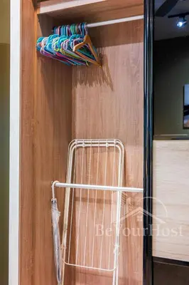 a towel rack on a wall with a bunch of towels at Continew Residences Kuala Lumpur in Kuala Lumpur
