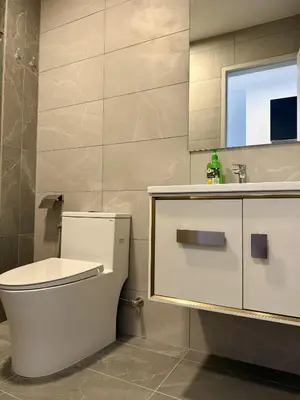 a bathroom with a toilet and a sink at The Majestic Residence Kuala Lumpur in Kuala Lumpur