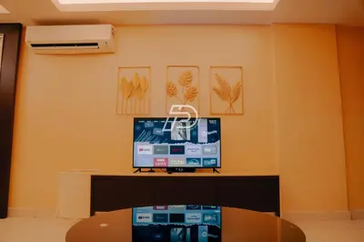 a room with a desk with a computer on it at KL Hartamas 2BR Wifi Smart TV in Kuala Lumpur