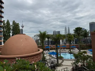 a view of a resort with a pool and a building at Times Square KL Serviced Suite in Kuala Lumpur