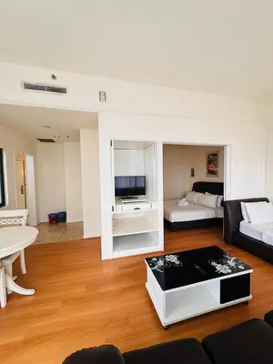 a living room with a couch and a table at Times Square KL Serviced Suite in Kuala Lumpur