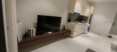 a living room with a large flat screen tv at Quill Residence KLCC Suites City Home in Kuala Lumpur
