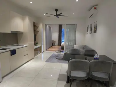 a kitchen and living room with a ceiling fan at Quill Residence KLCC Suites City Home in Kuala Lumpur