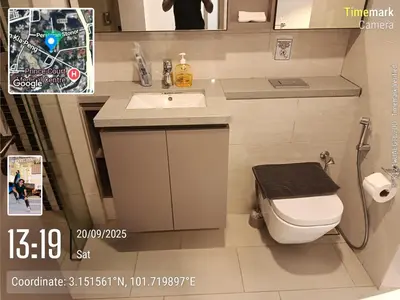 a bathroom with a white toilet and a sink at Eaton resident full luxury in Kuala Lumpur