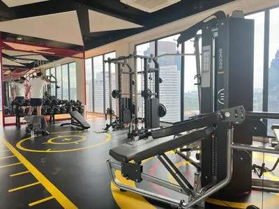 a gym with tread machines and people in the background at Luxury couple suite 1906A at KLCC in Kuala Lumpur