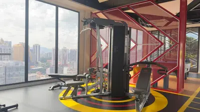 a gym with a view of a city at Luxury couple suite 1906A at KLCC in Kuala Lumpur