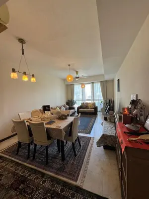 a living room with a table and chairs in a room at Signature Suite at Time Square by Regal in Kuala Lumpur