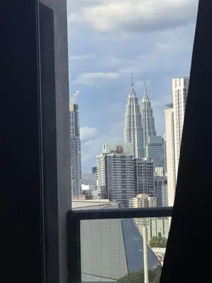 a view of a city skyline from a window at Signature Suite at Time Square by Regal in Kuala Lumpur