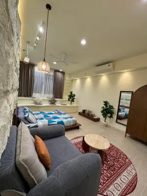 a living room with a couch and a bed at PWTC Chamber Rock by AZ Line in Kuala Lumpur