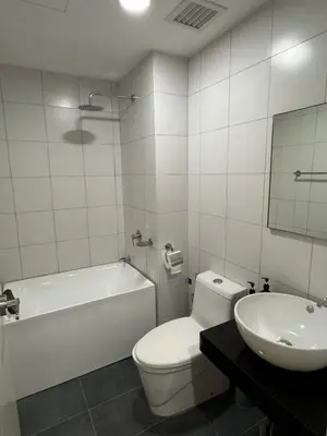 a bathroom with a tub and a toilet and a sink at PWTC Chamber Rock by AZ Line in Kuala Lumpur