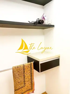 a sign on a wall with a towel on a shelf at Swiss Garden Residence by The Layar Homes in Kuala Lumpur