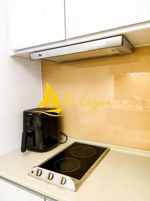 a kitchen counter with a coffee pot on a stove at Swiss Garden Residence by The Layar Homes in Kuala Lumpur