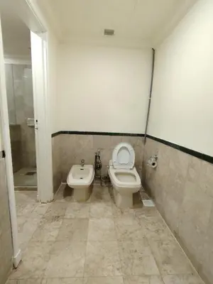 a bathroom with a toilet and a bidet at Grand Lumia Suite At Times Square KL in Kuala Lumpur