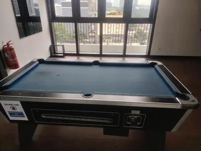 a pool table in a room with a window at SUITES At CHAMBERS KLCC KUALALAMPUR in Kuala Lumpur