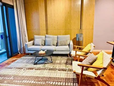 a living room with a couch and a table at The Mews KLCC Service Suites in Kuala Lumpur