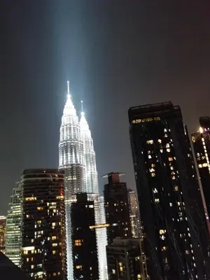 a view of a tall building at night at The Mews KLCC Service Suites in Kuala Lumpur