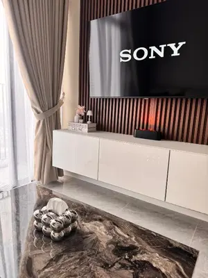 a living room with a sony tv on the wall at Luxury Sky Homes with KLCC VIEW in Kuala Lumpur