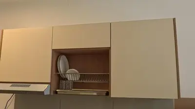 a cupboard with a plate and dishes in it at Luxury Suites Majestic Residences at Heart of KLCC in Kuala Lumpur