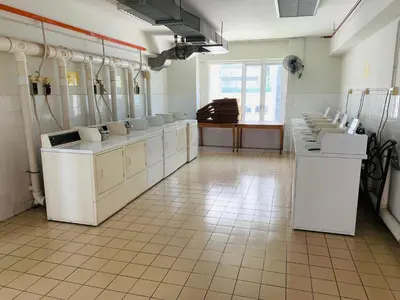 a bathroom with sinks and toilets in a room at Sweet cozy house by seri bukit Ceylon in Kuala Lumpur