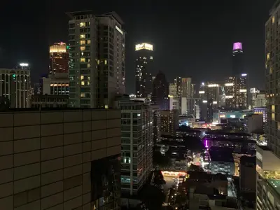 a view of a city at night at Sweet cozy house by seri bukit Ceylon in Kuala Lumpur
